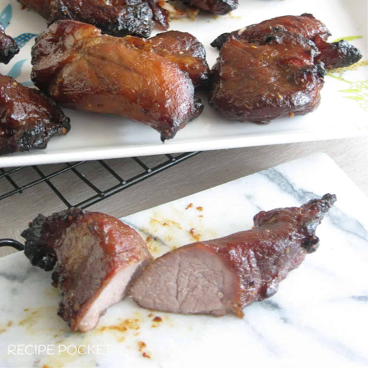 Homemade Chinese BBQ pork on a white plate.