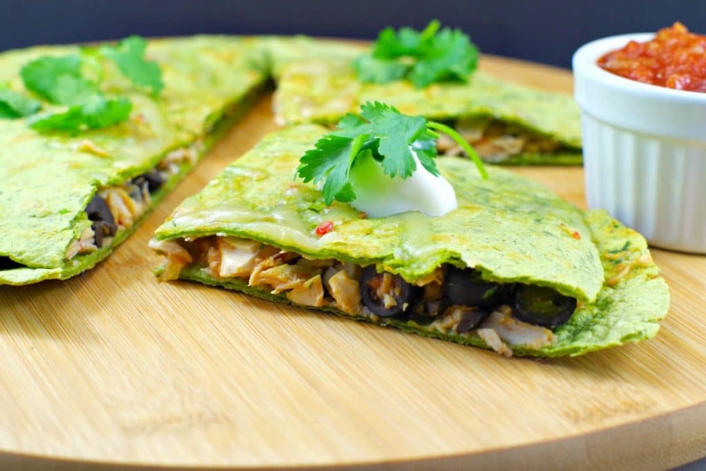 Rotissarie Chicken quesadilla on a round board.