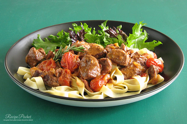 Images showing pasta served with lamb pieces that have been slow cooked in red wine sauce.