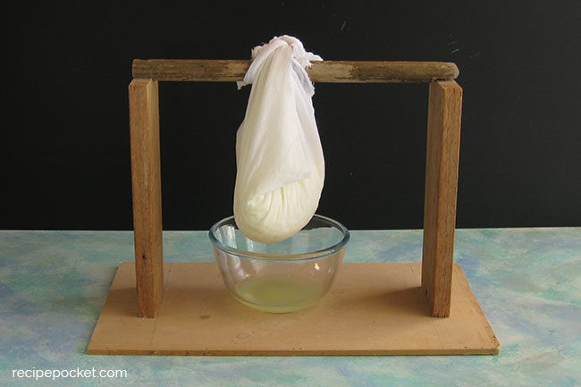 Draining ricotta cheese.