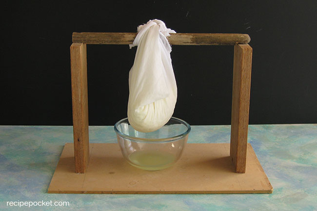 Draining ricotta cheese.
