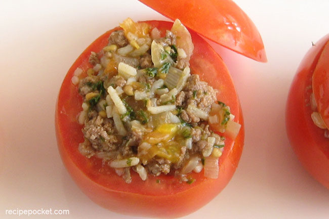 Tomatoes stuffed with mince meat filling.