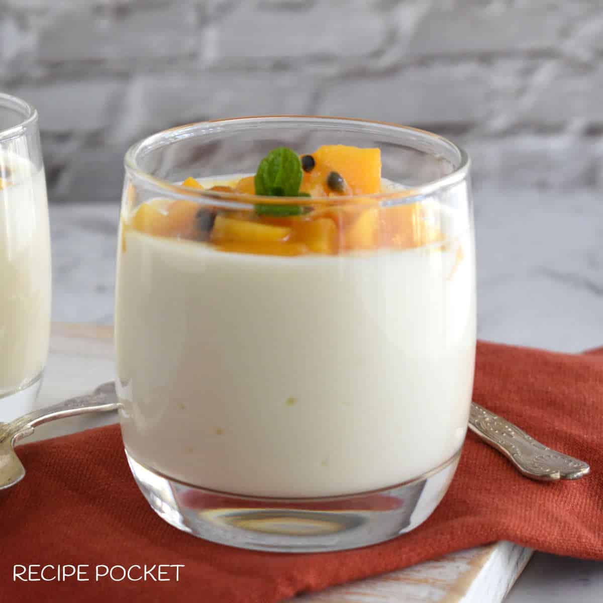 A glass filled with Greek yogurt.
