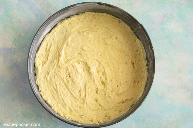 Easy raspberry Greek yogurt cake. Fill cake pan with half the batter.