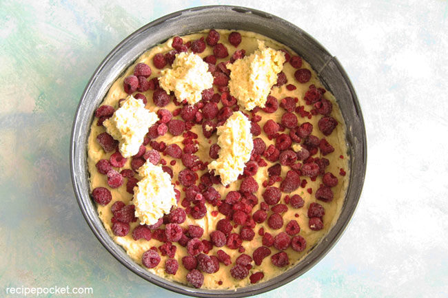 Easy raspberry Greek yogurt cake. Cover the berries with the remaining batter.