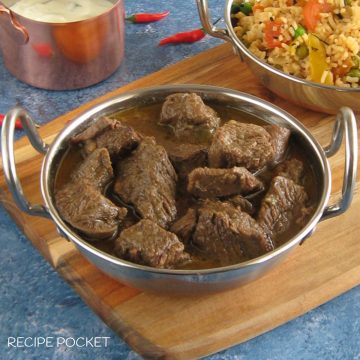 Beef curry in a serving dish.