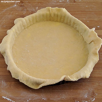 Shortcrust pasty lining the tin.