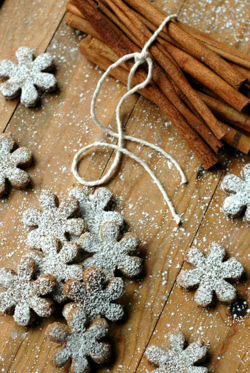 Slower shaped cookies with powdered sugar.