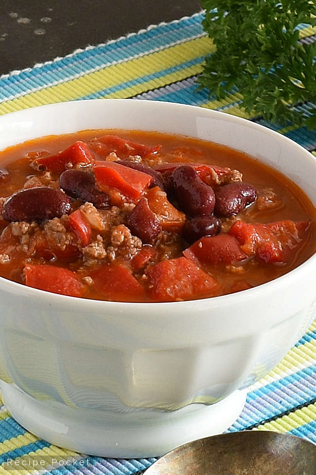 Close up of a bowl of beef chilli bean soup.
