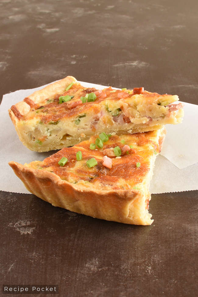 Closeup of two slice of quiche lorraine.