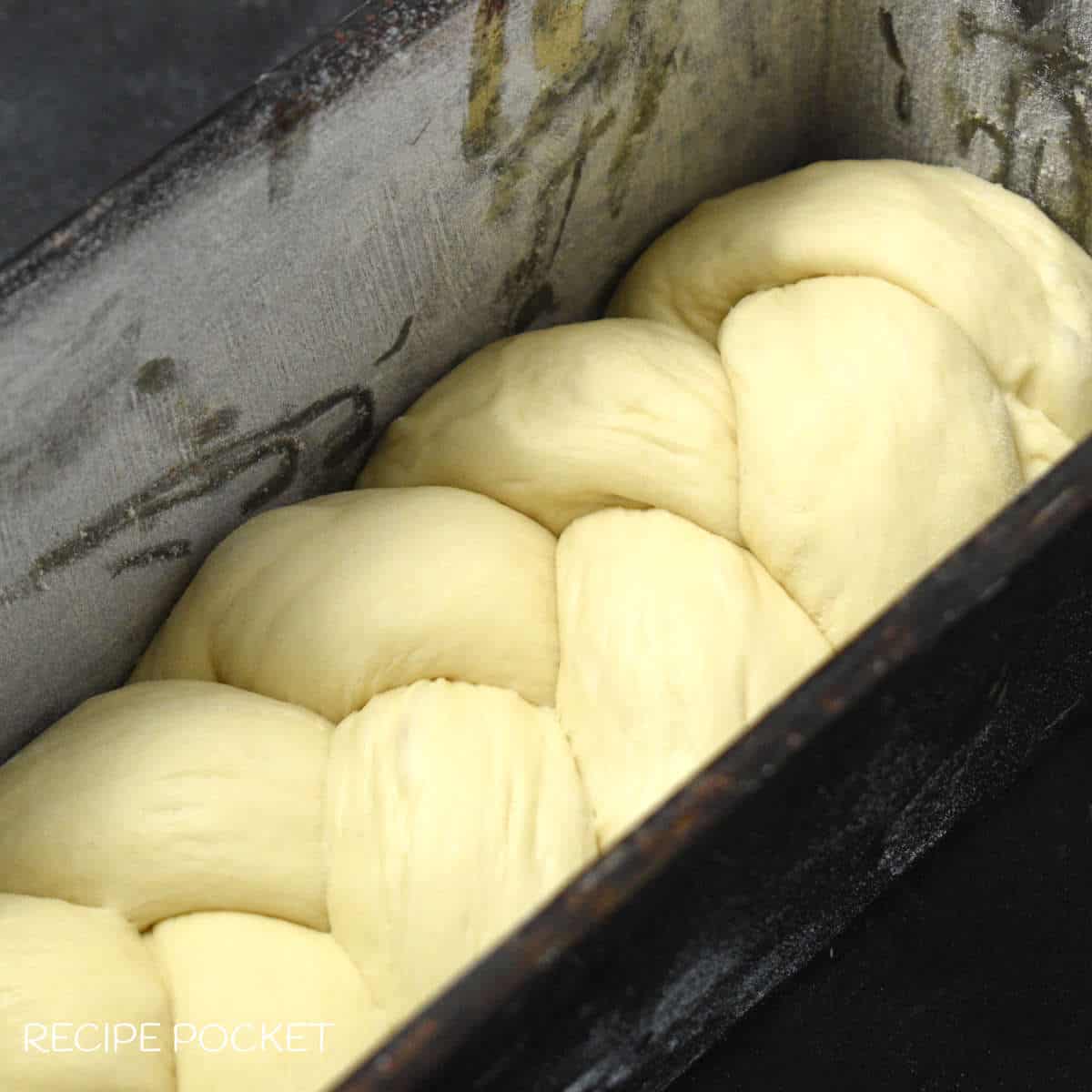 Bread dough in a bread tin.