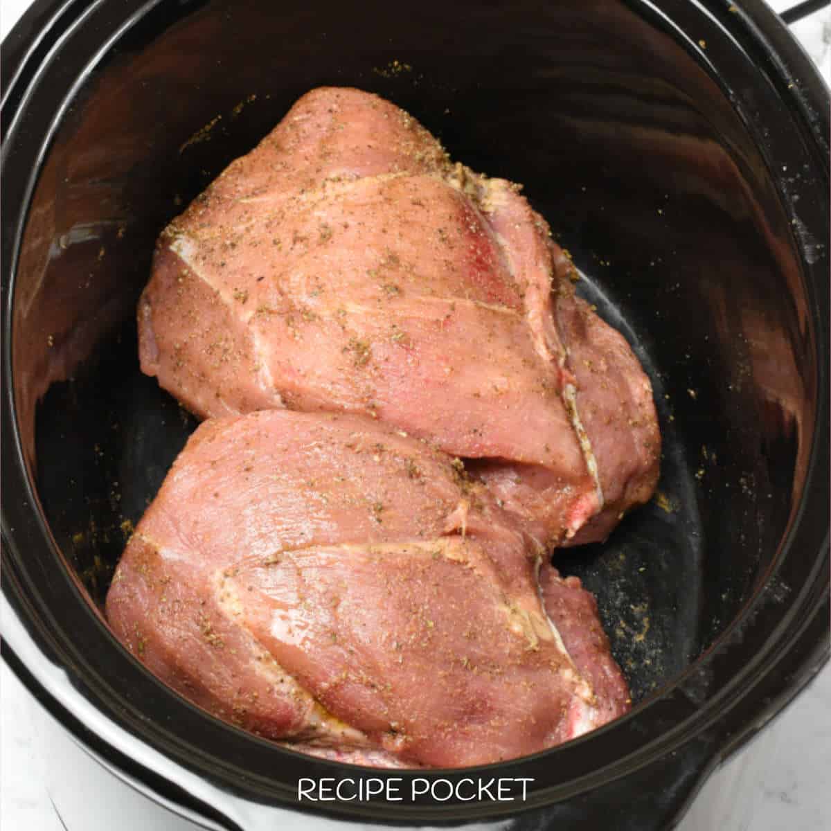 Pork shoulder in a slow cooker.