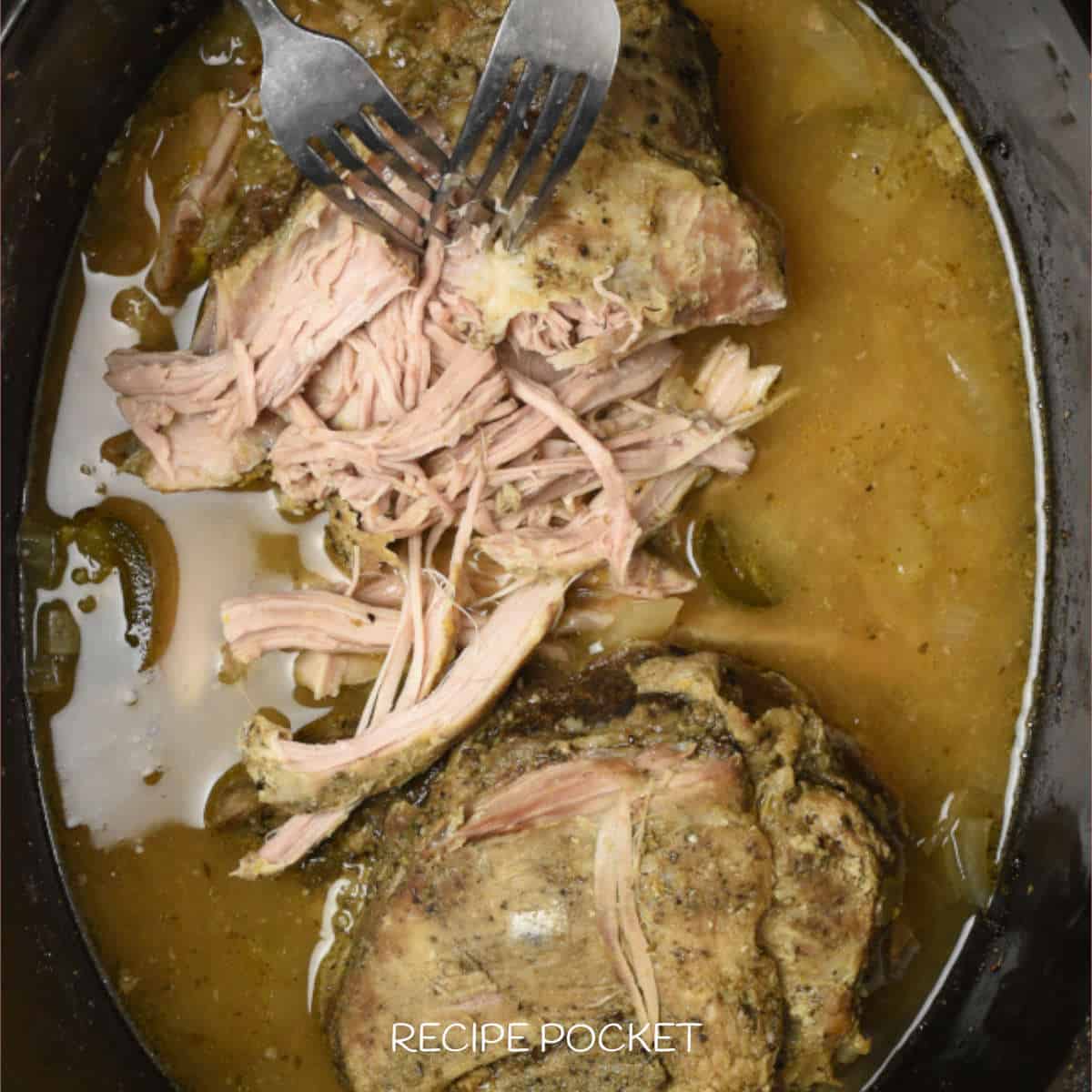 Cooked meat in a slow cooker.