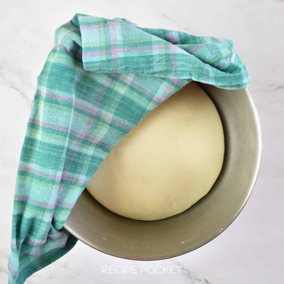 Dough inder a cloth.