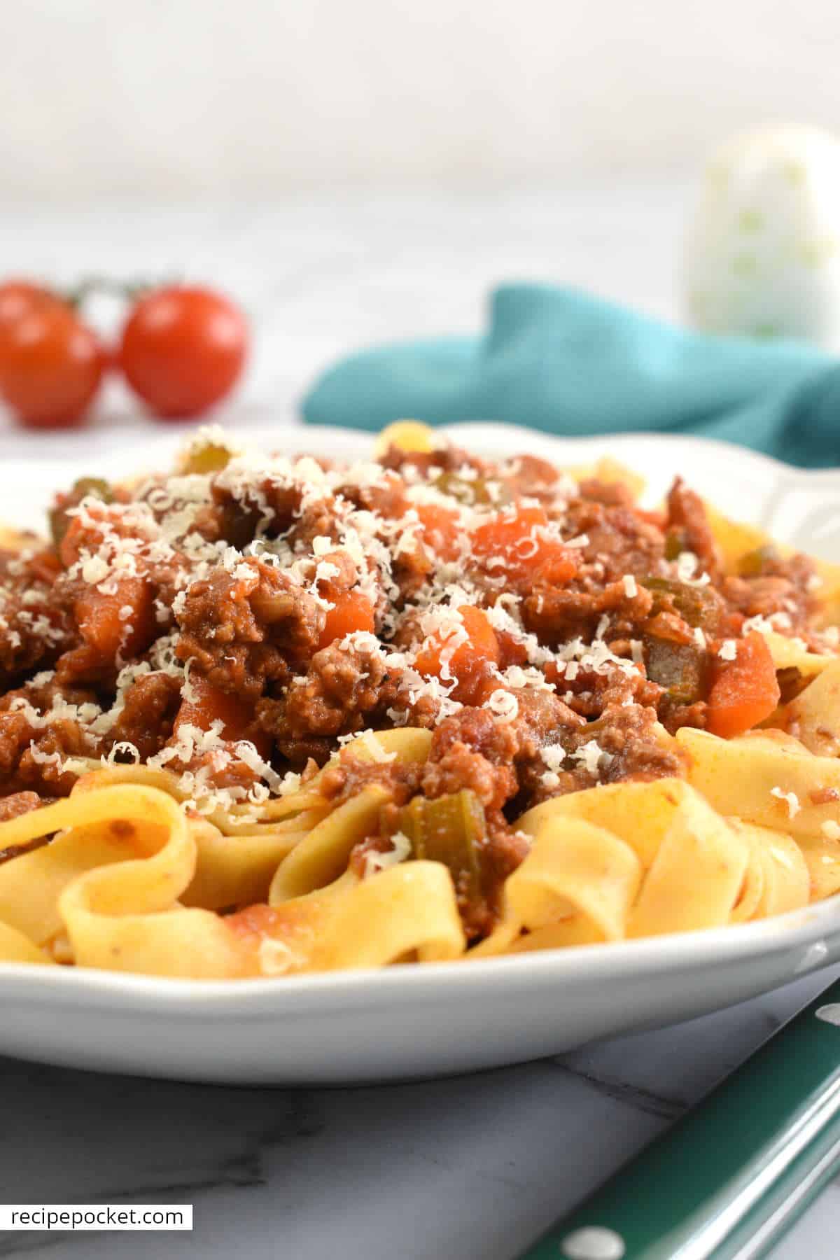 Beef and pork ragu with grated parmesan cheese.