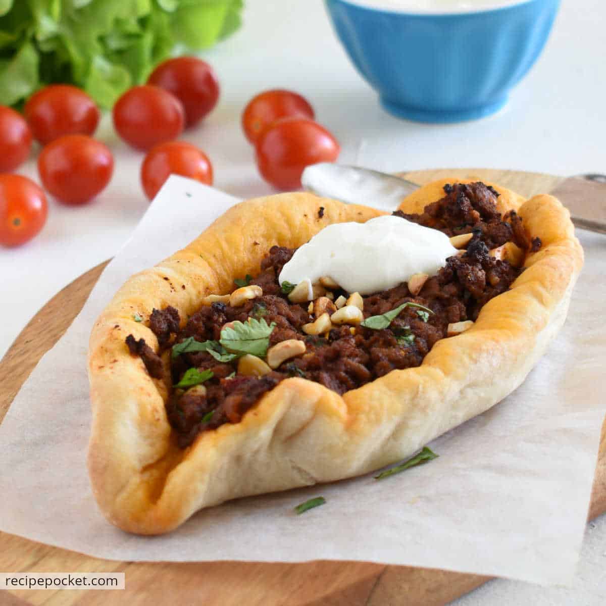 Homemade Turkish pizza with lamb mince and Greek yogurt on tops.