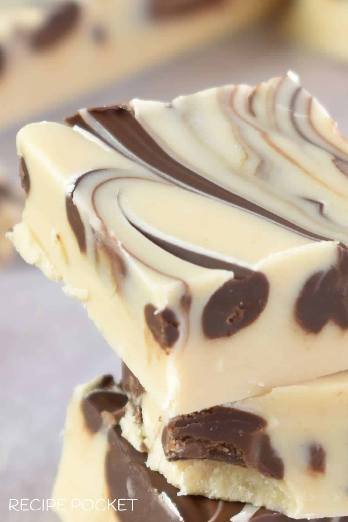 A close up of tiger butter fudge.