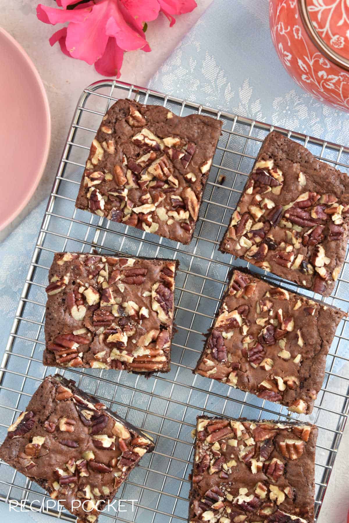 Top down view of brownies on a silver cake rack.