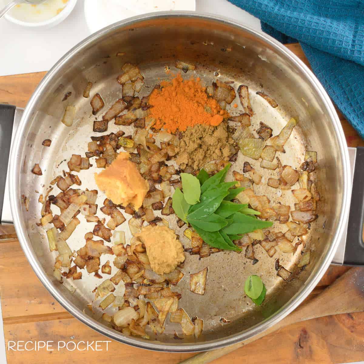 Fried onions and spices in a pot.
