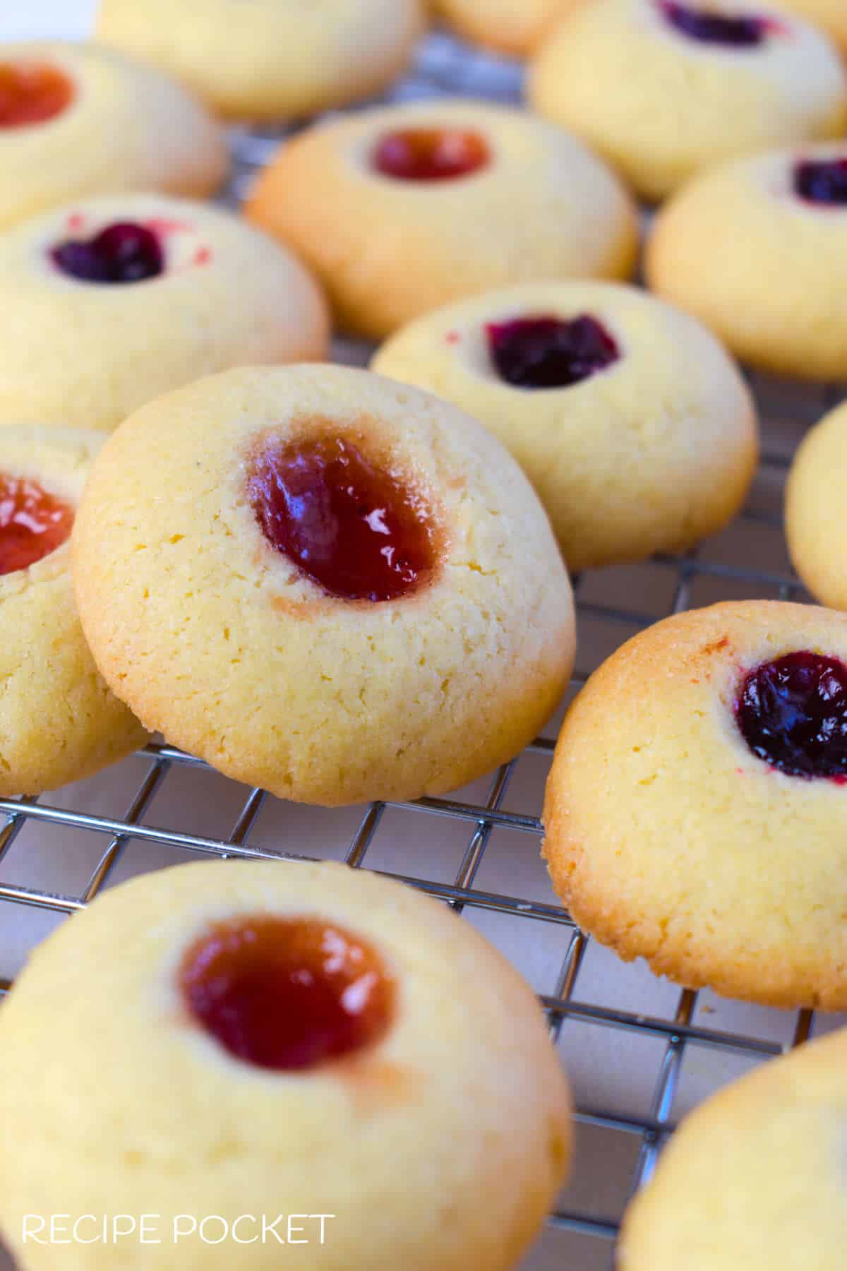 Jam drop cookies on a cake rack.