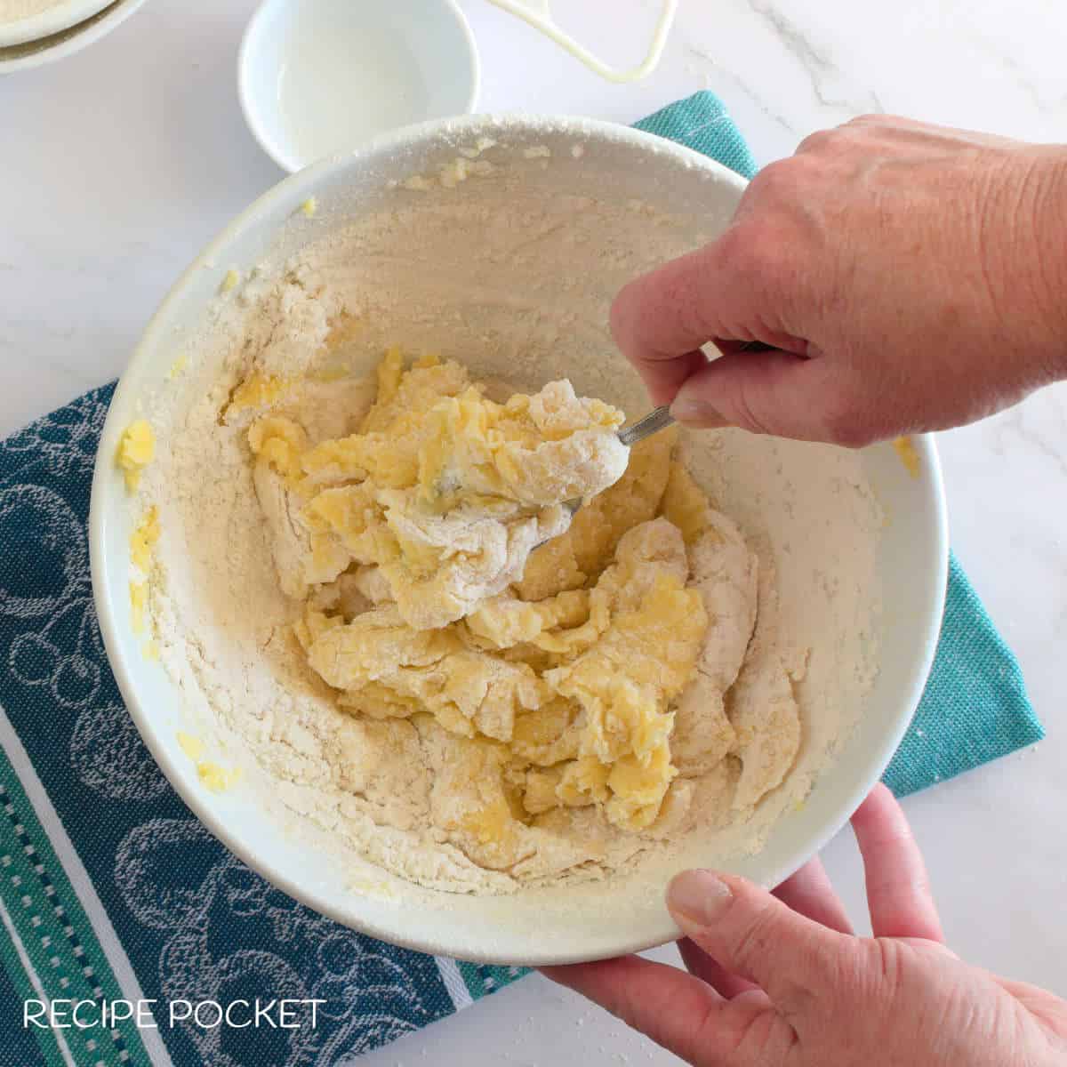 Jam drop cookie batter in a bowl.