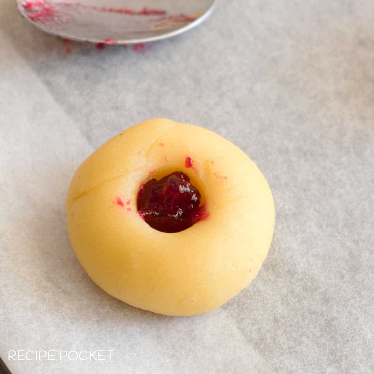 Unbaked jam drop cookie.