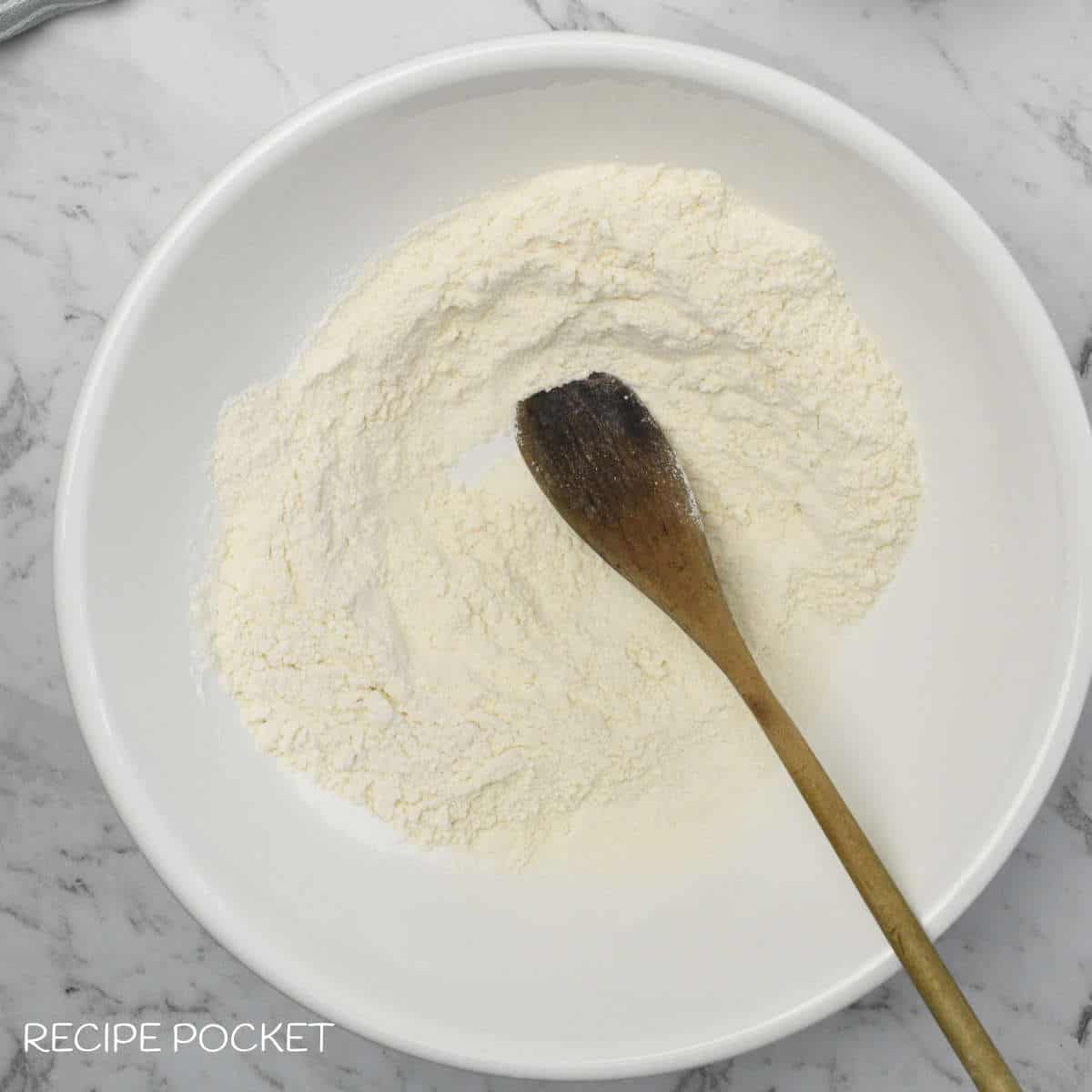Flour in a bowl.
