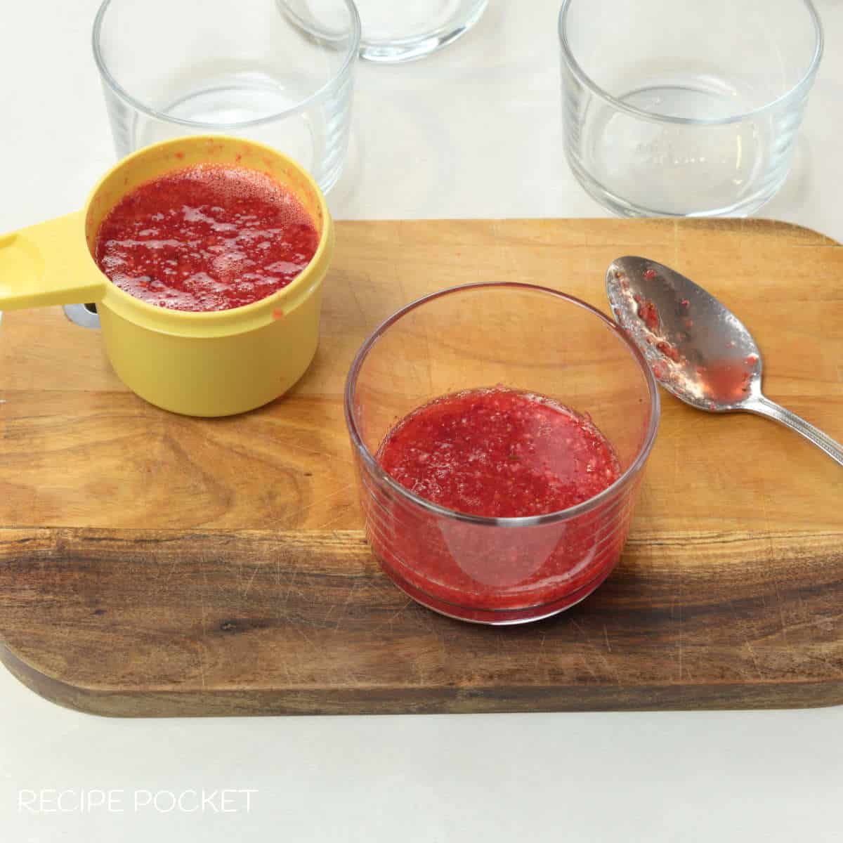Strawberry puree in a glass.