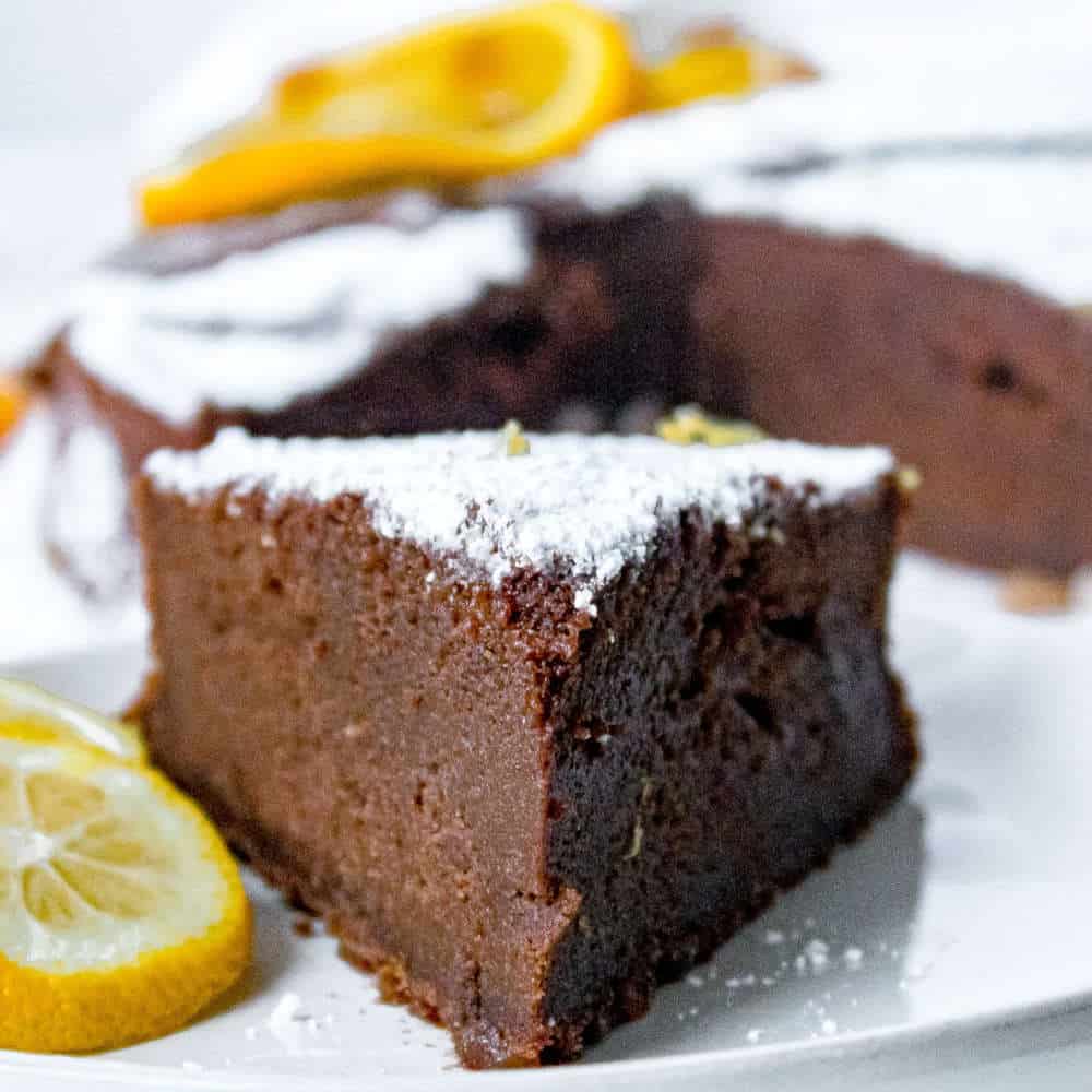 Chocolate cake with a dusting of powdered icing sugar.