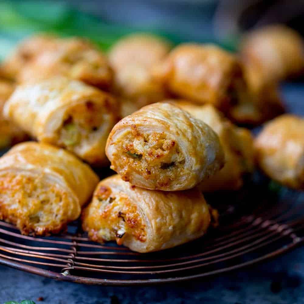 Vegetarian sausage rolls on a wire rack.