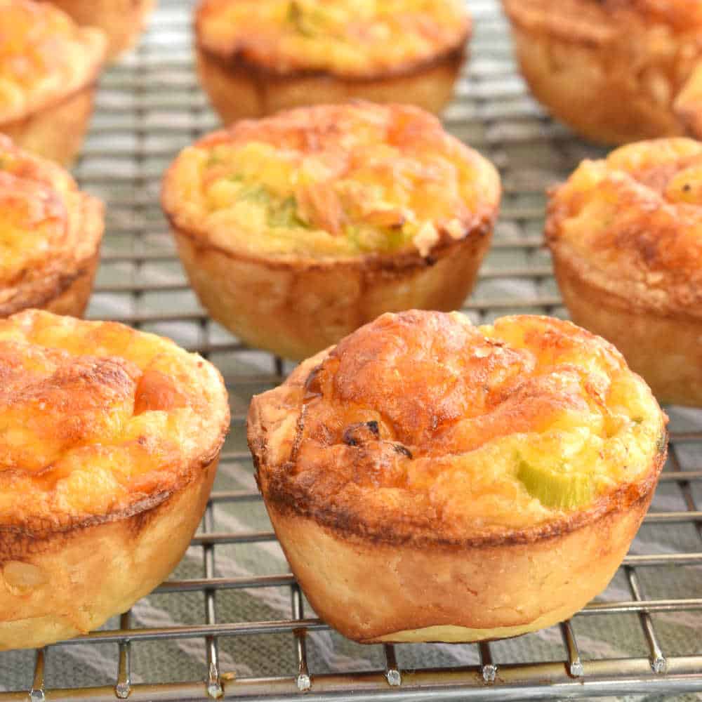Mini puff pastry bites in a wire rack.