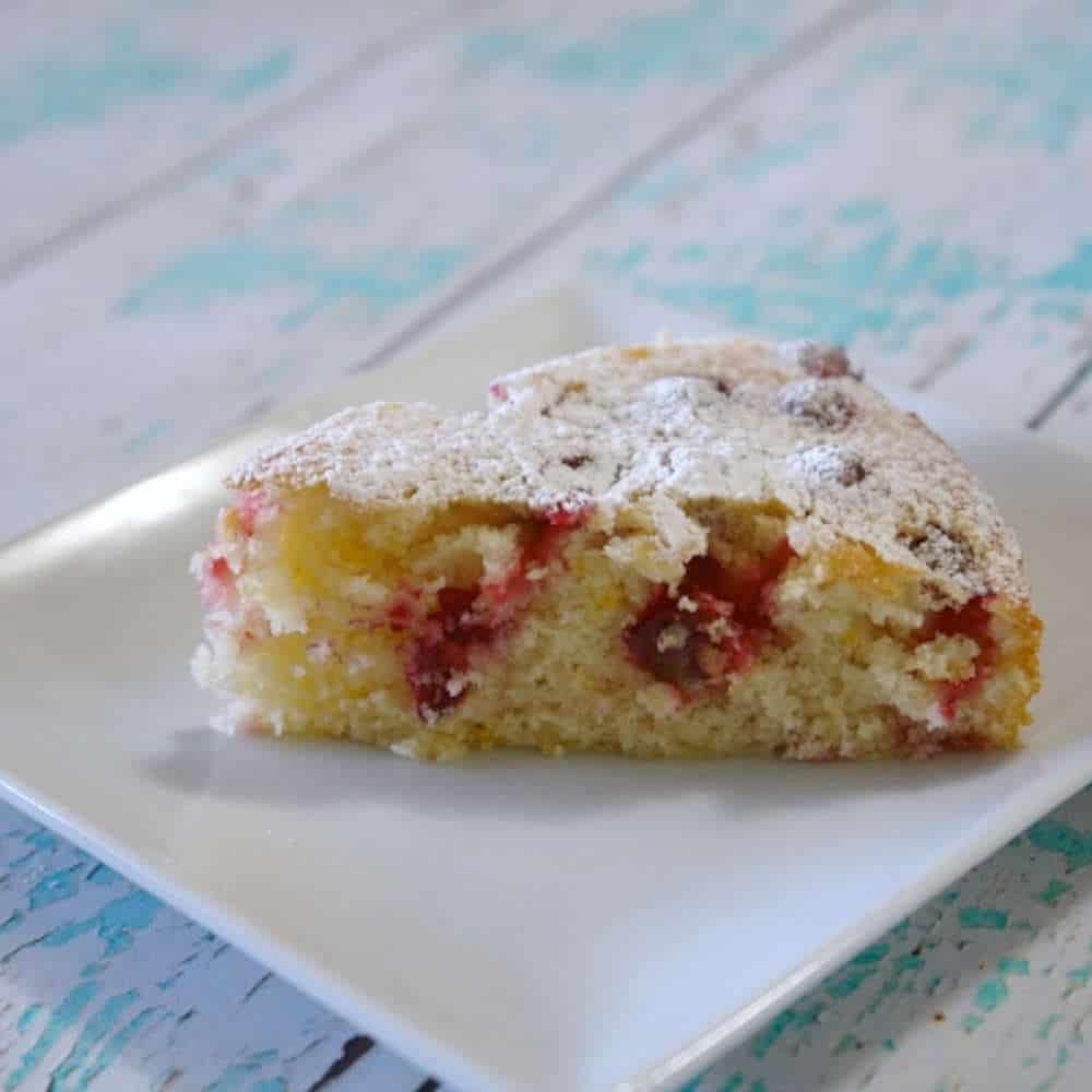 Cake on a plate on a blue table.