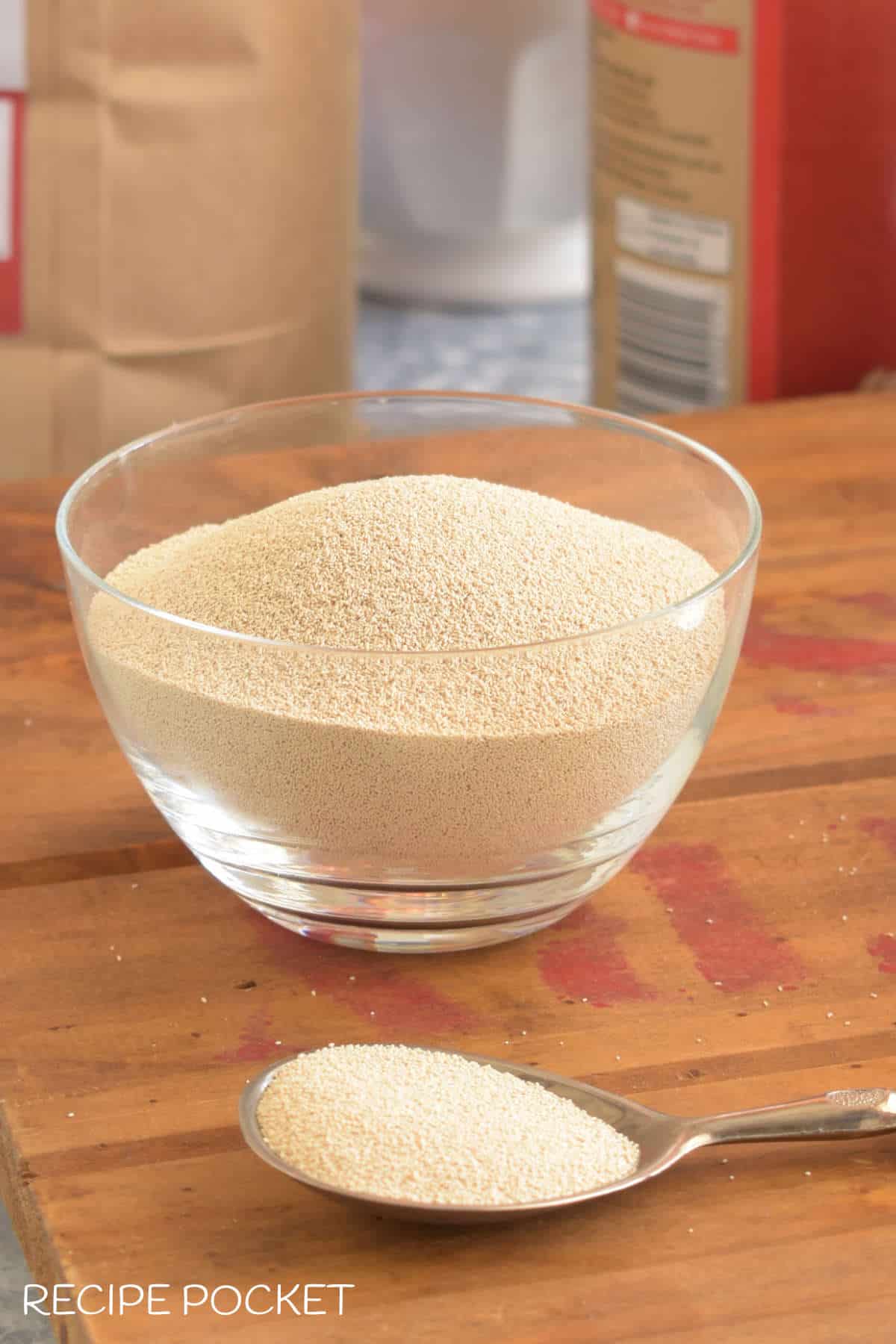 Closeup of dry yeast graduals in a bowl for a blog post on how to use instant yeast.