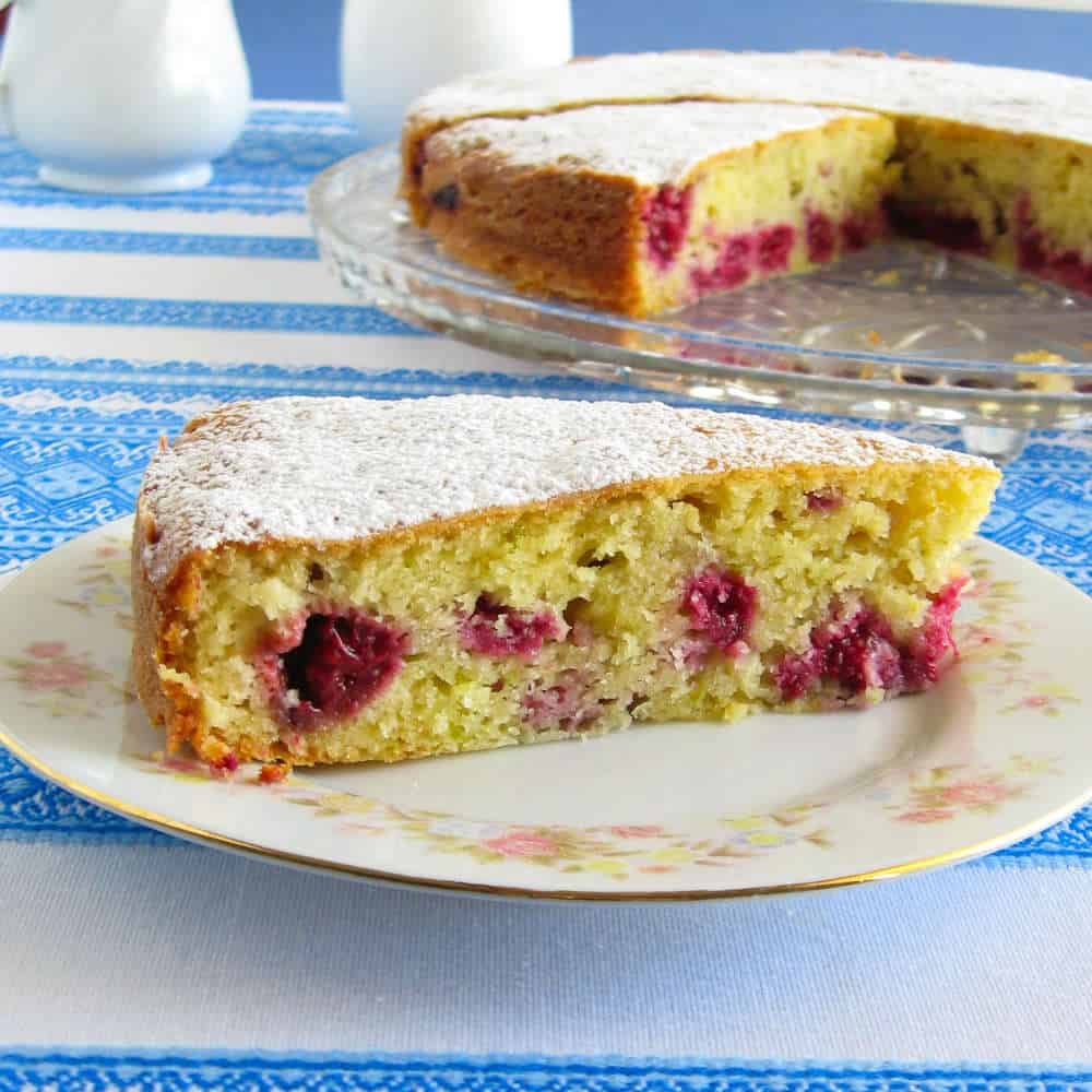 A slice of cake on a white plate.