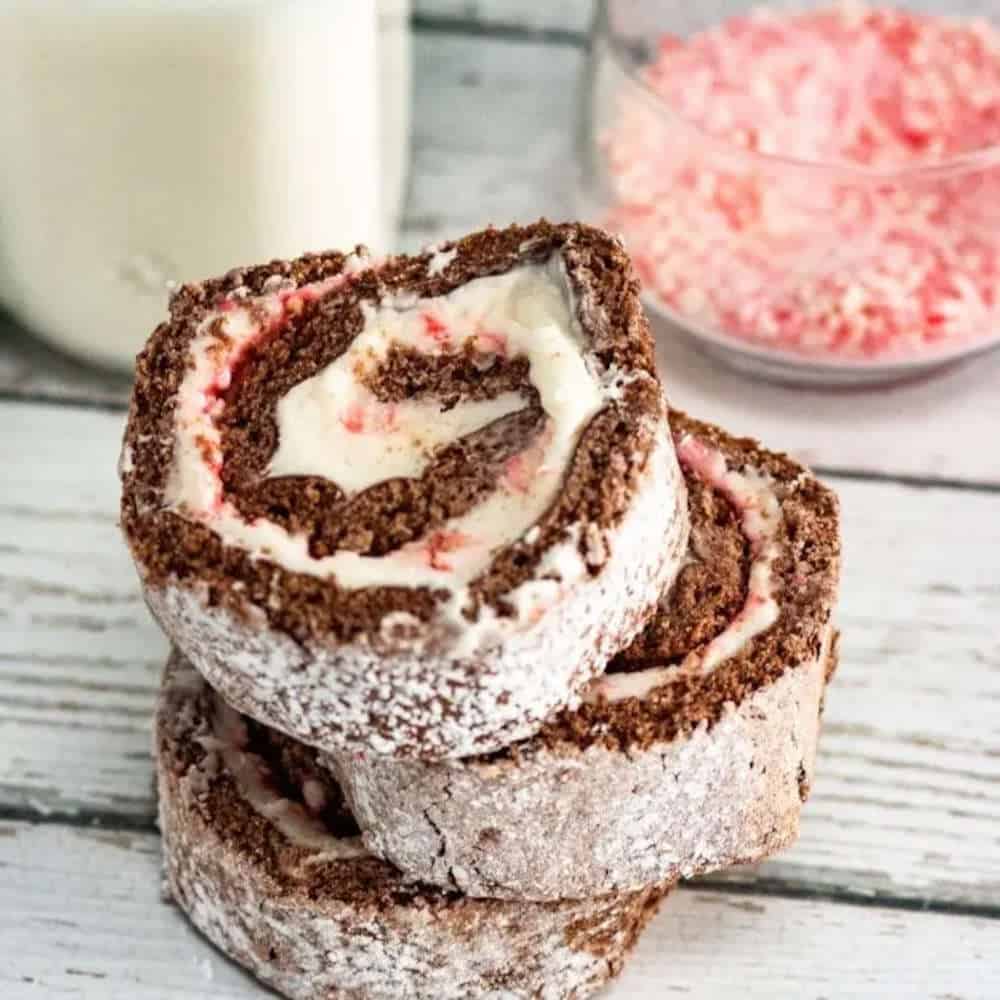 Three pieces of chocolate swiss roll cake.