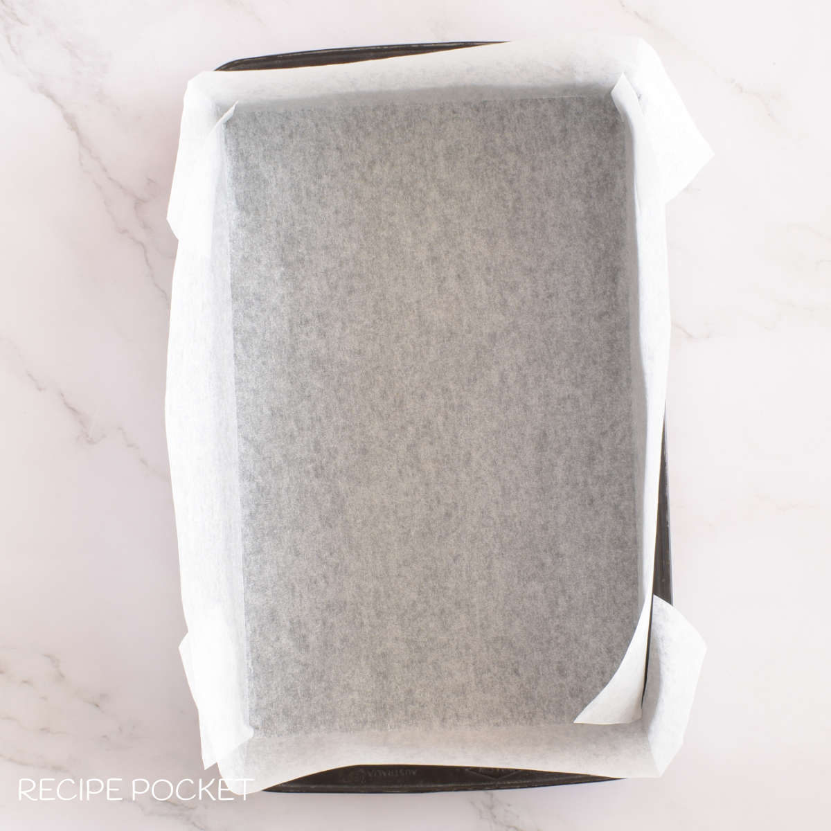 Baking tin lined with baking paper.