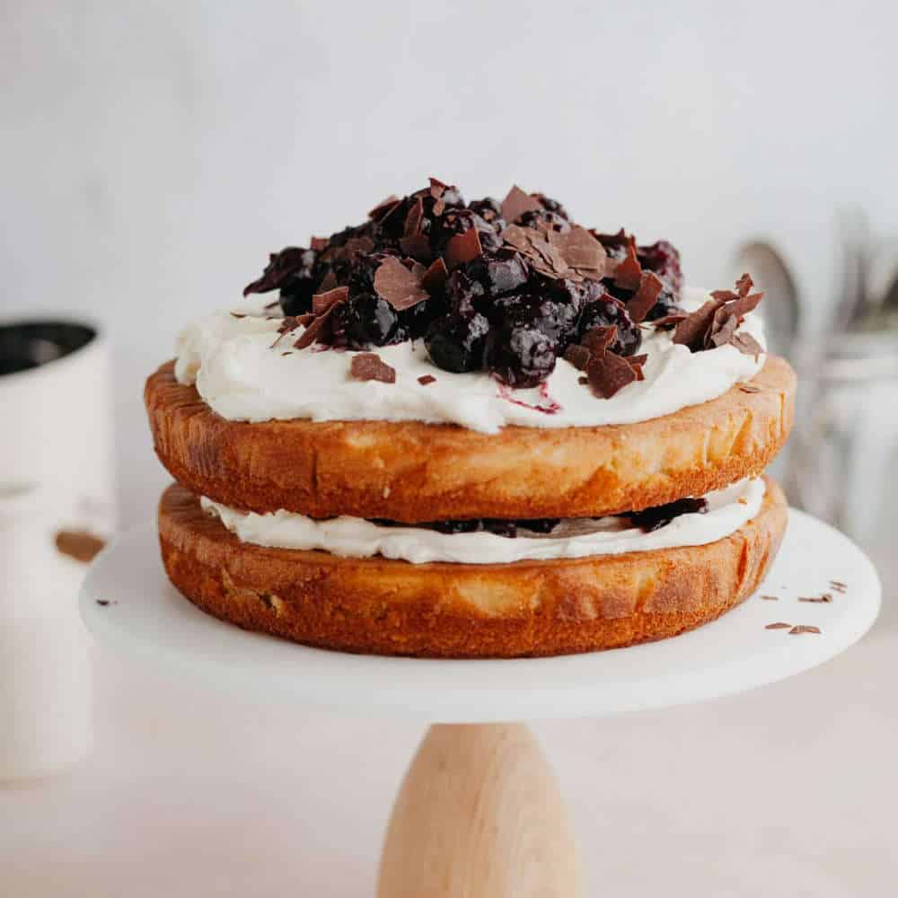 White forest cake on a cake stand.