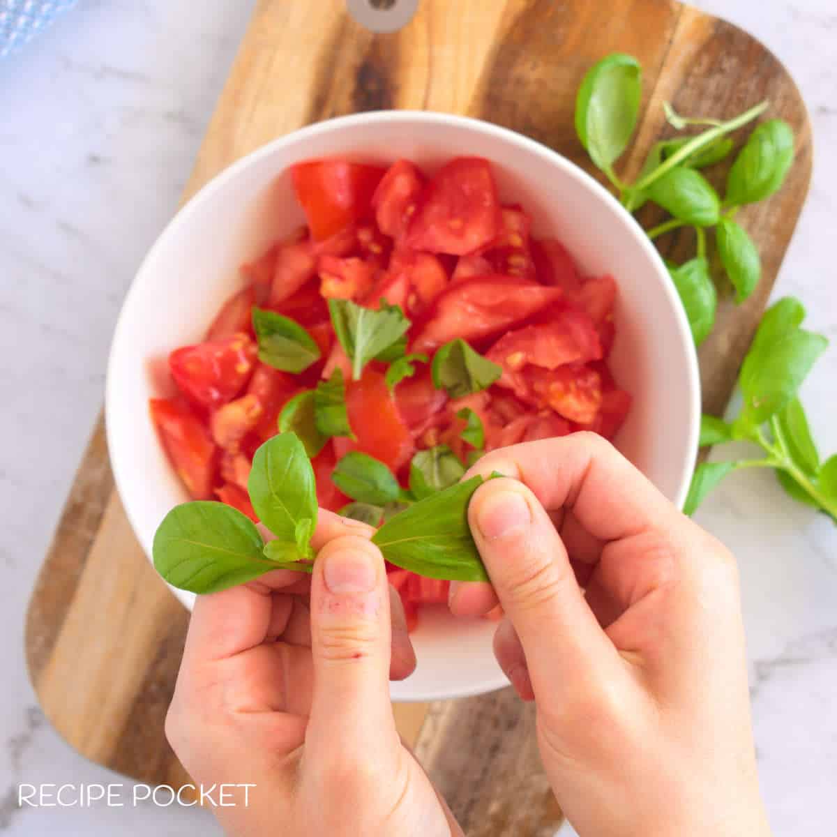 Tomato and fresh basil leaves.