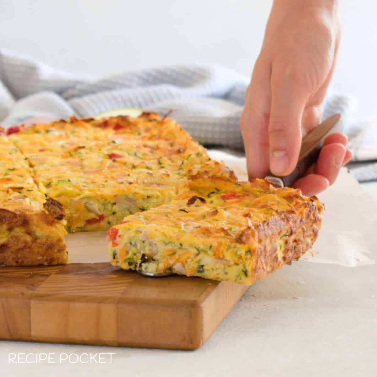 Carrot zucchini slice on a wooden board.