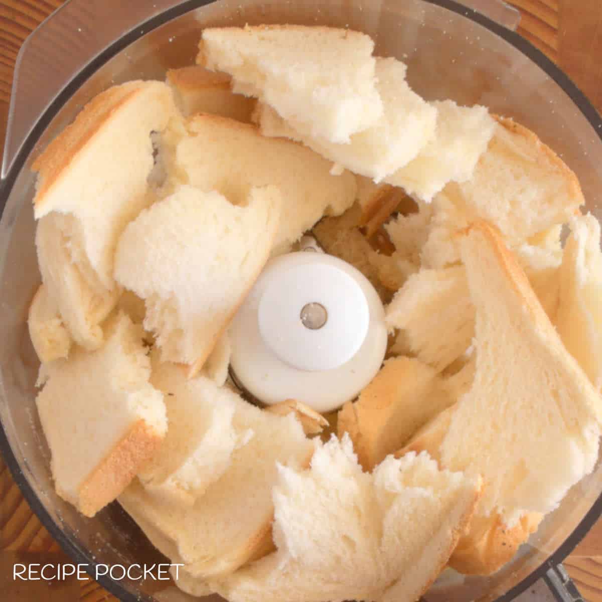Pieces of bread in a food processor.