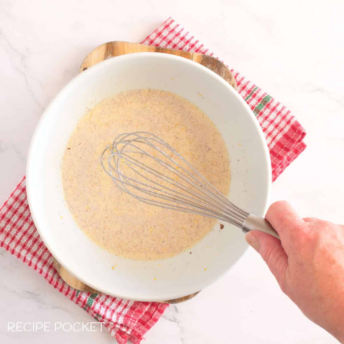 Mixing wet ingredients.