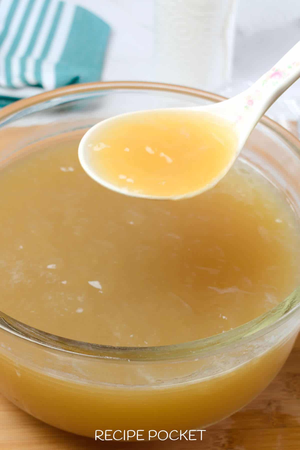 Image showing thick chicken broth gel on a spoon.