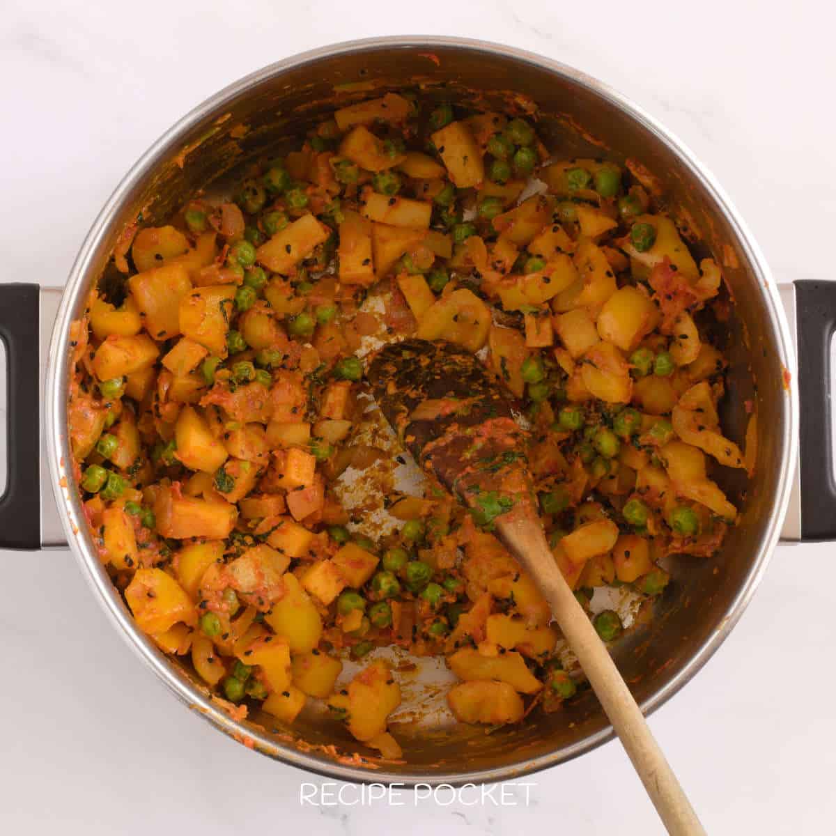 Cooked vegetables in a saucepan.