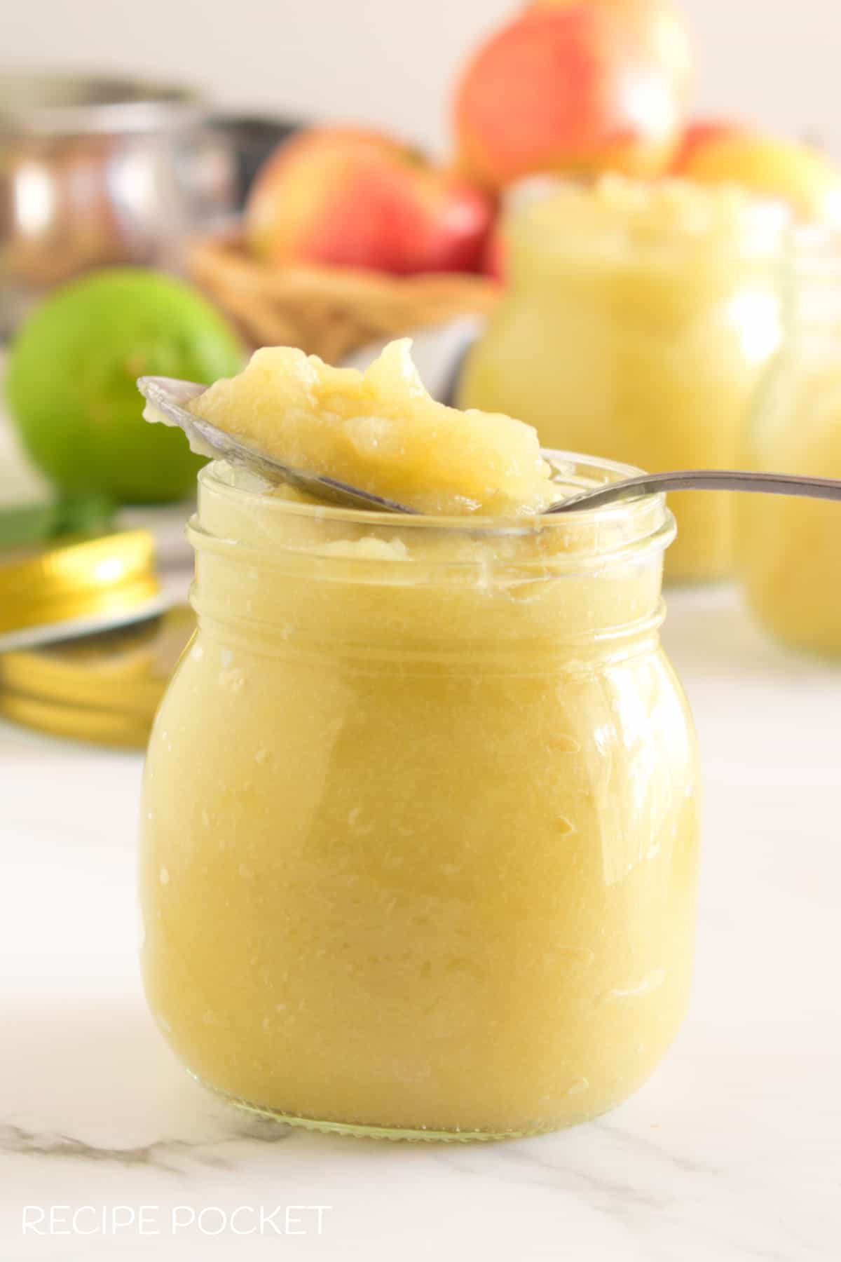 Apple sauce on a spoon.