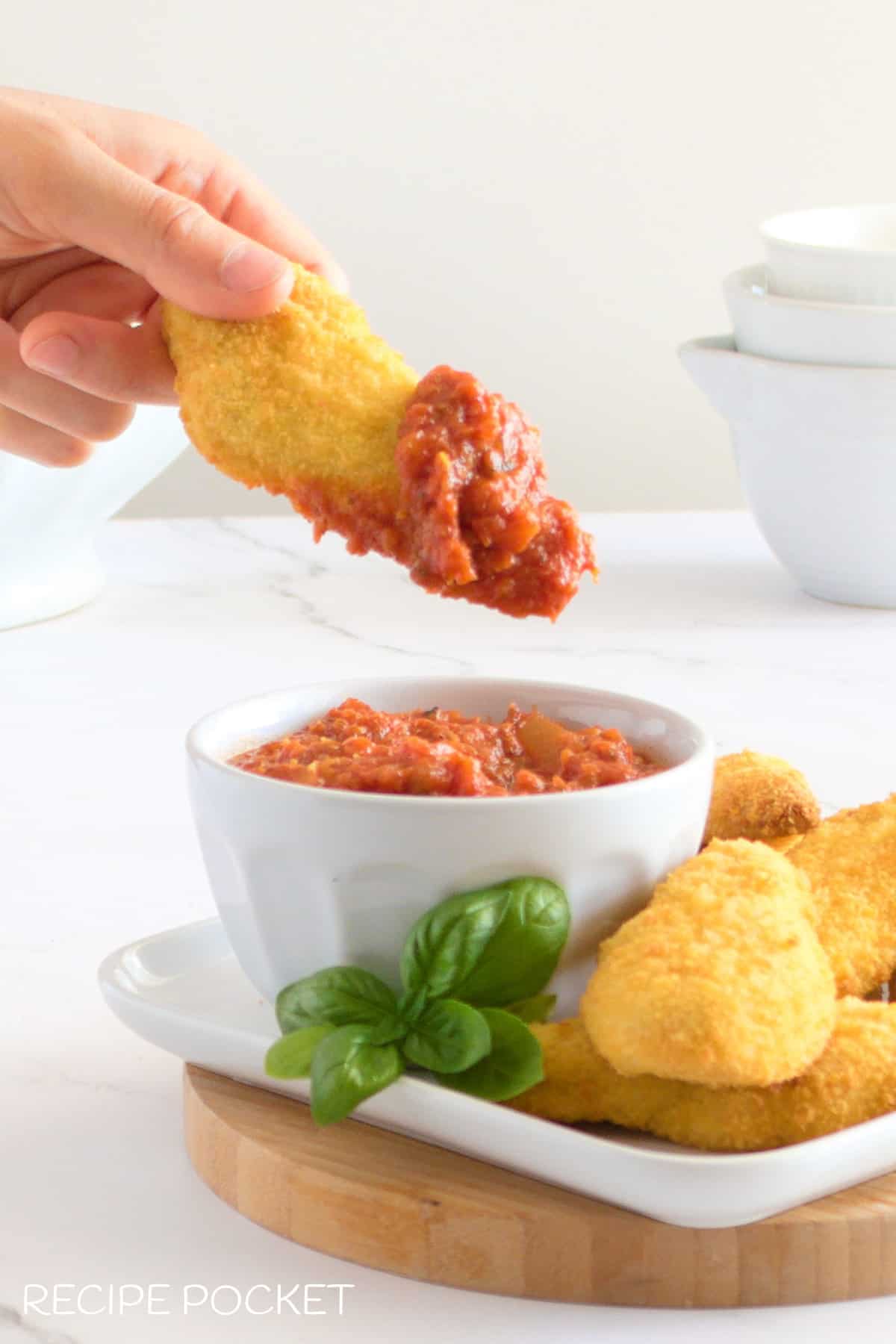 Crumbed chicken and marinara sauce.