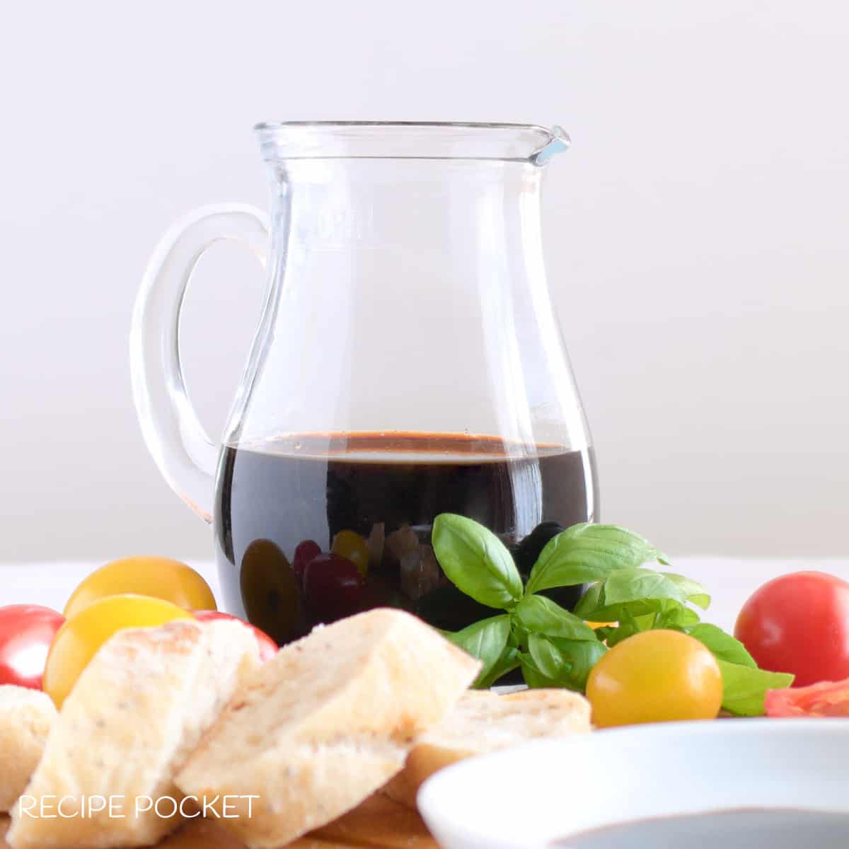 Caramelized balsamic vinegar in a glass jug.