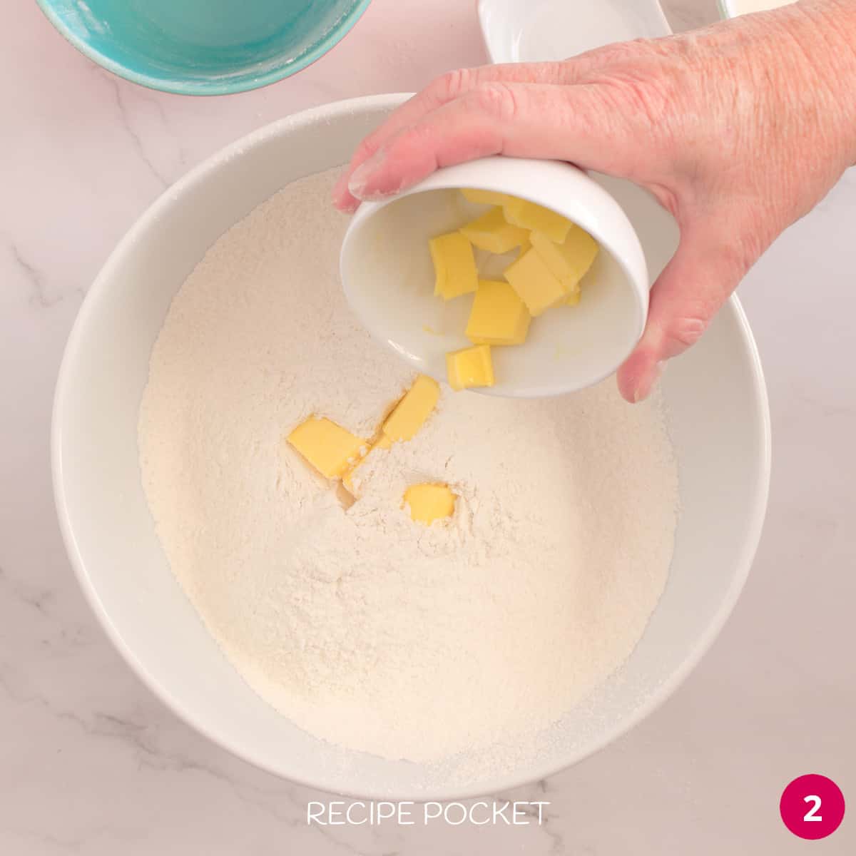 Cubes of butter in flour.