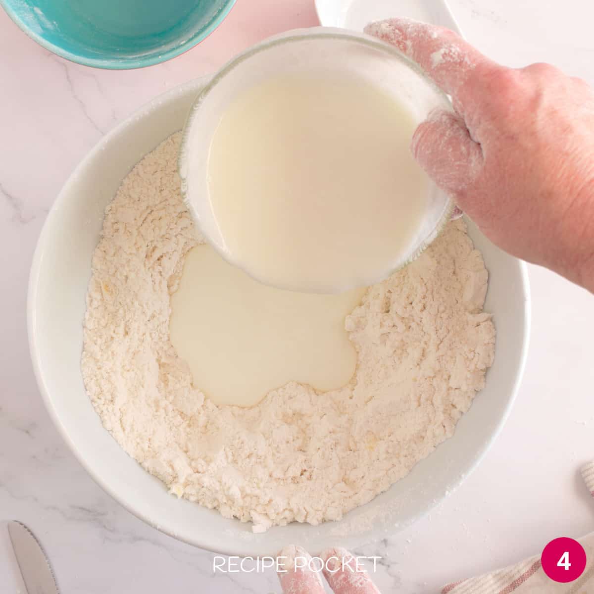 Buttermilk being added to flour and butter mixture.