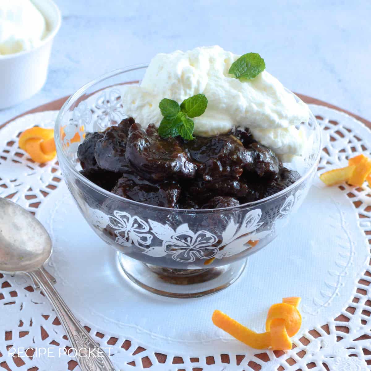 Stewed prunes with cream.