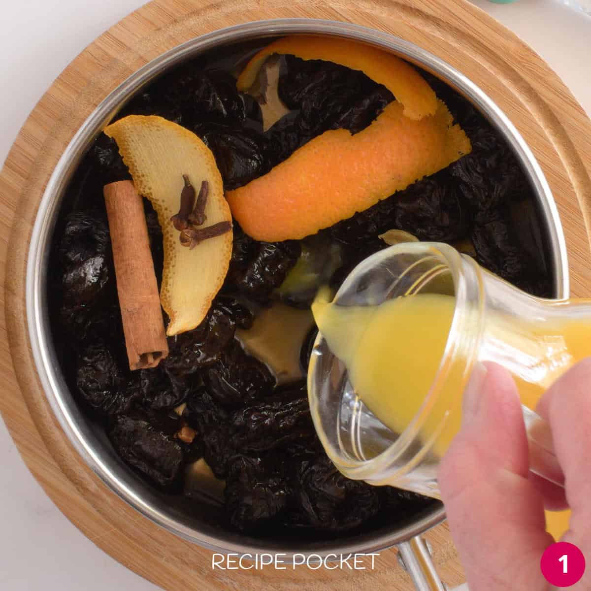 Ingredients for stewed prunes in a pot before cooking.